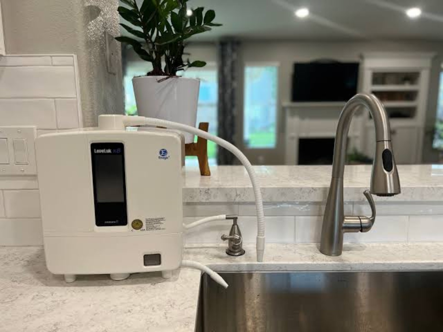 Leveluk K8 installed beside a modern kitchen sink